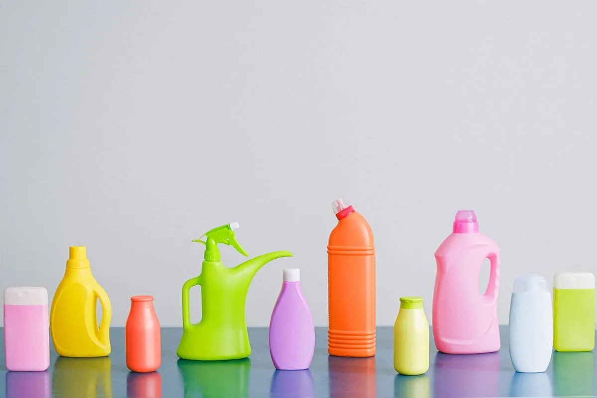 Colorful household and personal-care products lined up on a shelf